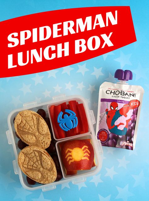 a lunch box with cookies, jelly and spiderman lunches in it on a blue background