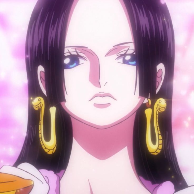 a woman with long black hair wearing large gold hoop earrings and purple eyes is staring at the camera