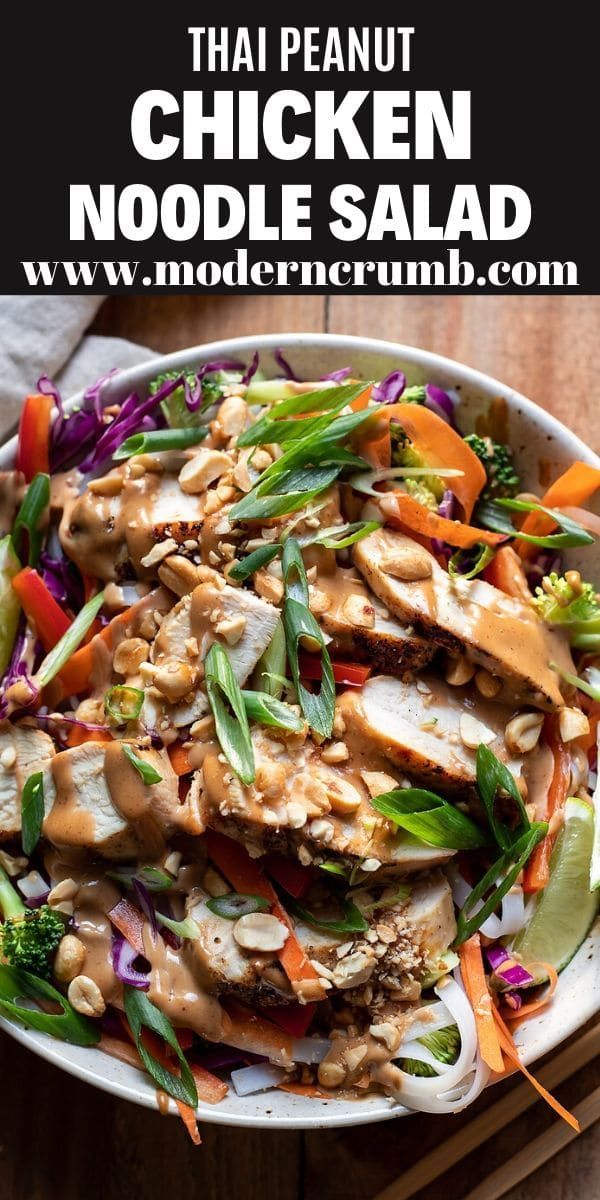 thai chicken noodle salad in a white bowl with chopsticks on the side