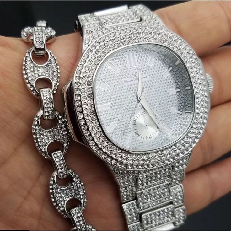 This Listing Is For Both The Watch And Mariner Link Bracelet Men's Hip Hop White Gold Pt Luxury Watch & Icey Bracelet Combo Set Bracelet: Hip Hop Celebrity Full Iced Cz Diamond Chain Bracelet Adjustable From 7.5-10 Inches 12mm Width Luxury Bling Bracelet Watch: 100% Brand New Finish: White Gold Case Size: 45mm X 45mm Case Back: Stainless Steel Lab Simulated Diamonds On The Bezel & Band Movement: Quartz Japan Battery Included Lock: Fold Over Removable Links (Adjustable) Luxury Style Iced Out White Gold Watch Gift, Timeless White Gold Iced Out Jewelry And Watches, Timeless Iced Out Jewelry Gift, Silver Iced Out Watch Accessories For Gifts, Timeless Silver Iced Out Jewelry, Timeless Iced Out Silver Jewelry, Silver Diamond Watch With Bracelet Strap As Gift, White Diamond Watch With Polished Finish As Gift, White Diamond Watch With Polished Finish