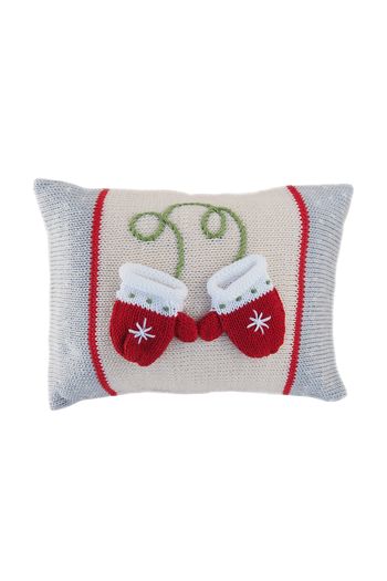 a knitted pillow with two red mittens on it