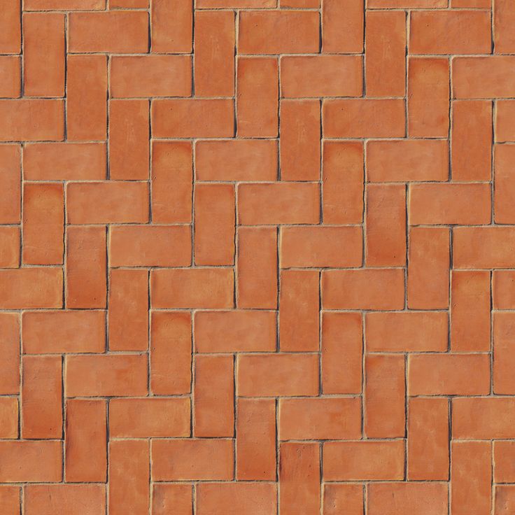 an orange brick wall with small squares on it