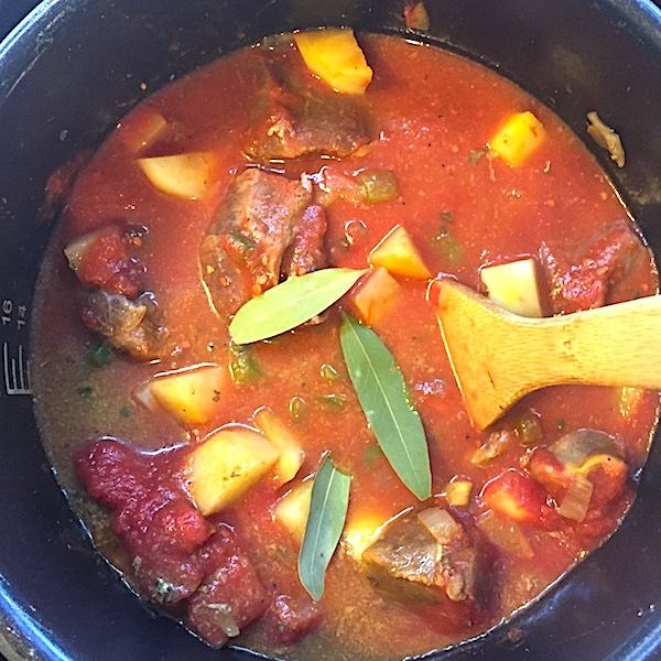 a pot filled with meat and vegetable stew