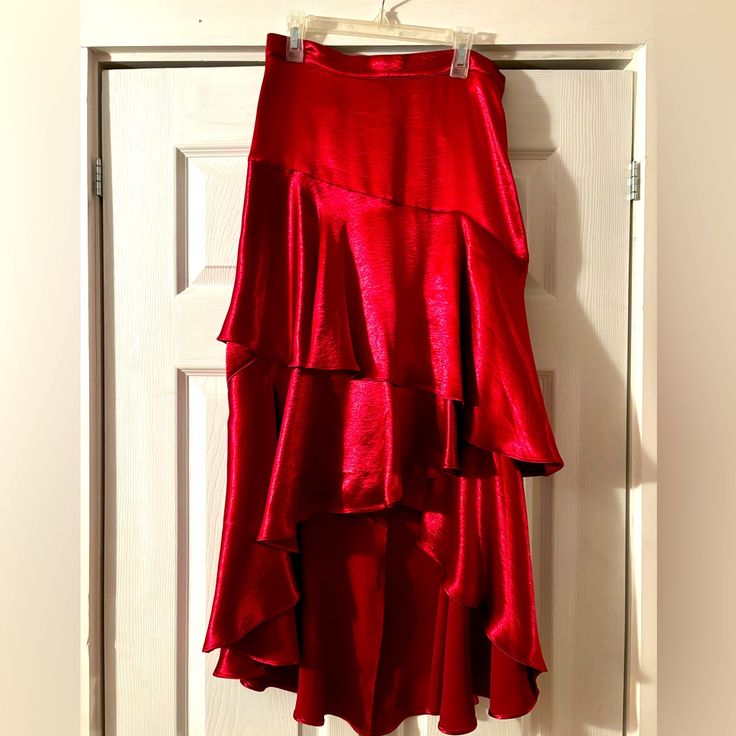 Red Silk Tiered Skirt, Fits Beautifully. Nwt. Waist - 28” Length - 24.5” (Front) 36” (Back) Chic Red Maxi Skirt For Night Out, Red Asymmetrical Lined Maxi Skirt, Red Asymmetrical Maxi Skirt With Lining, Red Maxi Skirt For Night Out, Red Asymmetrical Relaxed Skirt, Red Asymmetrical Relaxed Fit Skirt, Red Asymmetrical Flowy Skirt, Red Midi Skirt For Night Out, Fitted Red Maxi Skirt For Night Out