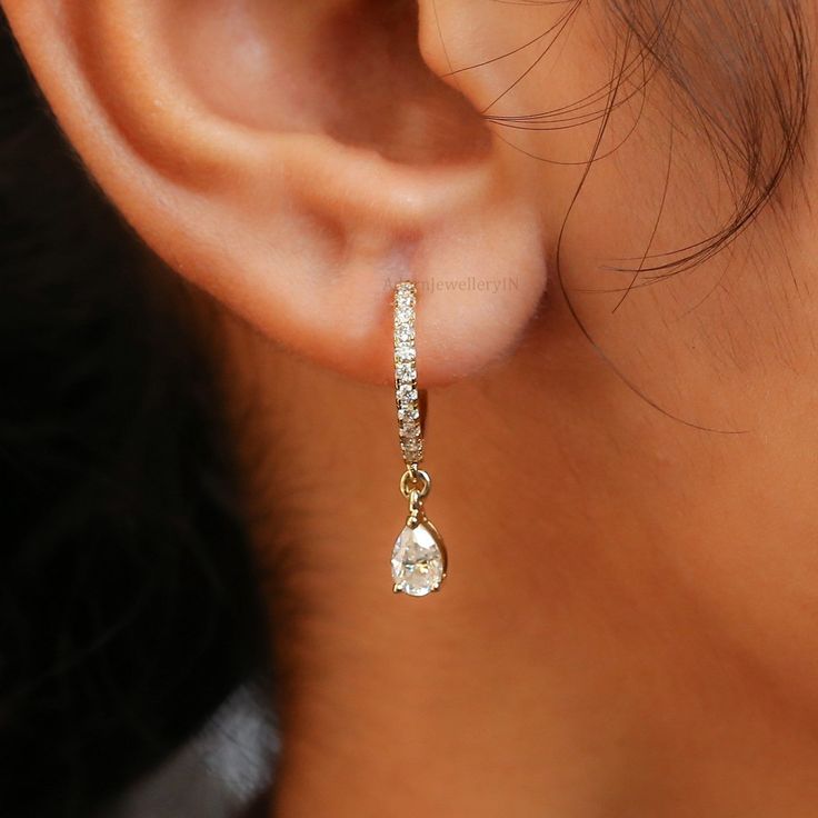 Pear Moissanite Dangle & Drop Earrings/Tear Drop Huggies Earrings/Helix Hoop Earrings/14K Gold Wedding Earrings/Latch Back Style Earrings/ ✥ 𝐖𝐞𝐥𝐜𝐨𝐦𝐞 𝐭𝐨 𝐀𝐝𝐨𝐫𝐧𝐉𝐞𝐰𝐞𝐥𝐥𝐞𝐫𝐲𝐈𝐍: 𝐔𝐧𝐯𝐞𝐢𝐥 𝐭𝐡𝐞 𝐁𝐞𝐚𝐮𝐭𝐲 𝐨𝐟 𝐆𝐨𝐥𝐝 & 𝐌𝐨𝐢𝐬𝐬𝐚𝐧𝐢𝐭𝐞 𝐃𝐢𝐚𝐦𝐨𝐧𝐝 𝐉𝐞𝐰𝐞𝐥𝐫𝐲! ✥ ↣ 𝐌𝐚𝐭𝐞𝐫𝐢𝐚𝐥𝐬: 925 Sterling Silver, Gold, Rose Gold, White Gold ✥ 𝐌𝐨𝐢𝐬𝐬𝐚𝐧𝐢𝐭𝐞 𝐃𝐢𝐚𝐦𝐨𝐧𝐝 𝐒𝐩𝐞𝐜𝐢𝐟𝐢𝐜𝐚𝐭𝐢𝐨𝐧𝐬: ↣ 𝐒𝐡𝐚𝐩𝐞: Round Cut & Pear Cut  ↣ 𝐃𝐢𝐦𝐞𝐧𝐬𝐢𝐨𝐧: 1.50 MM & 6x4 MM  ↣ 𝐂𝐚𝐫𝐚𝐭 𝐖𝐞𝐢𝐠𝐡𝐭: 0.41 CTW (approx.) ↣ 𝐂𝐥𝐚𝐫𝐢𝐭𝐲: VVS ↣ 𝐂𝐨𝐥𝐨𝐫: Colorless ✥ 𝐖𝐡𝐲 𝐂𝐡𝐨𝐨𝐬𝐞 𝐌𝐨𝐢𝐬𝐬𝐚𝐧𝐢𝐭𝐞 𝐃𝐢𝐚𝐦𝐨𝐧𝐝: ↣ 𝐀𝐟𝐟𝐨𝐫𝐝𝐚𝐛𝐥𝐞 𝐋𝐮𝐱𝐮𝐫𝐲: Get fancy stuff without spending too much. ↣ 𝐆𝐨𝐨𝐝 𝐌𝐚𝐭𝐞𝐫𝐢𝐚𝐥𝐬: We use gems that don't ca Luxury White Gold Huggie Dangle Earrings, Single Teardrop Diamond Earring For Wedding, Teardrop Diamond Single Earring For Wedding, Wedding Teardrop Diamond Single Earring, Classic Teardrop Huggie Earrings For Wedding, Fine Jewelry Teardrop Huggie Earrings For Anniversary, Teardrop Huggie Earrings Fine Jewelry For Anniversary, Teardrop Huggie Earrings For Anniversary, Yellow Gold Teardrop Bridal Earrings For Pierced Ears