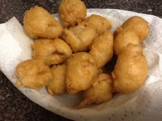 some fried food is in a paper bag