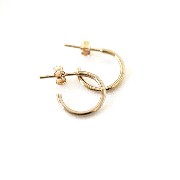 Tiny and dainty, gold filled, open hoop earrings.  Small hoop earrings are 12mm in diameter. Large hoop earrings are 20mm in diameter. Hoop widths are 1.27mm. Each item is individually handmade and made to order. The colors of each piece may appear different on phones, tablets and computer screens. Jewelry Care Instructions: - Avoid sprays or lotions near jewelry. - Keep jewelry stored separately from other pieces, in a cool, dark place using jewelry boxes and pouches. - Remove before bathing, s Small Hoop 14k Gold-filled Earrings, Simple Small Hoop 14k Gold Filled Earrings, Dainty Small Hoop Pierced Earrings, Earrings Small Hoop, Flower Necklace Gold, Minnie Mouse Earrings, Huggie Earrings Gold, Dainty Hoop Earrings, Open Hoop Earrings