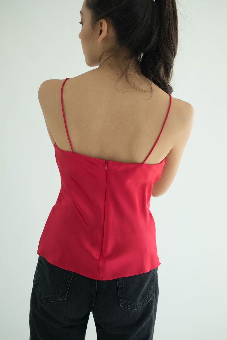 Signature Silk Top made in 100% Italian Silk is designed with a V-neckline and open back spaghetti straps. The bodice is constructed with subtle gathering at the bust. Stays fitted through the waist give the piece versatility to be styled. Product Details: Professional Dry Clean Composition: Premium Silk Satin Proudly made in Thailand Size+Fits: XS: Bust 31.5” Waist 24.5” Hips 35.5” S: Bust 33.5” Waist 26” Hips 37” M: Bust 35.5” Waist 28” Hips 39” L: Bust 37.5" Waist 30" Hips 41" XL: Bust 39.5” Slip Top, Silk Slip, Stay Fit, Silk Top, Silk Satin, Open Back, Bodice, Spaghetti Strap, Camisole Top