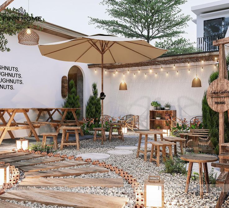 an outdoor restaurant with wooden tables and umbrellas