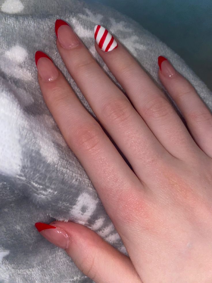 Nails Candy Cane, Candy Cane Nails French Tip, French Tip Candy Cane Nails, Red And White Christmas Nails French Tips, Christmas Nails Candy Cane, Christmas Nails Candy Cane French Tip, Coffin Candy Cane Nails, Christmas French Tips, Christmas Nails French Tip Red Candy Canes