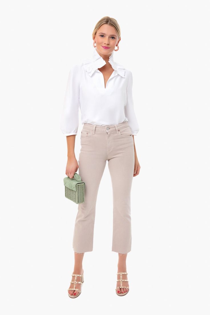 The White Stretch Poplin Ruffle Neck Bouvier Blouse is the perfect combination of femininity and sophistication. Equally appropriate at the office or cocktails with friends, it’s no wonder this blouse is a Tuckernuck favorite. We especially love this number because it leaves room for accessorizing, so add a colorful clutch and a bold accessories for a truly you look! Ruffle neck Button closure at neck Three-quarter length sleeves Straight fit Material: 100% Cotton Care: Machine wash cold. Tumble Chic Collared Blouse For Business Casual, Chic Blouse For Business Casual, Chic Ruffled Collar Blouse For Day Out, Chic Day Out Blouse With Ruffled Collar, Chic Blouse With Ruffled Collar For Day Out, Feminine Blouse For Business Casual, Elegant Collared Blouse For Brunch, Feminine Business Casual Blouse, Classic Blouse For Brunch