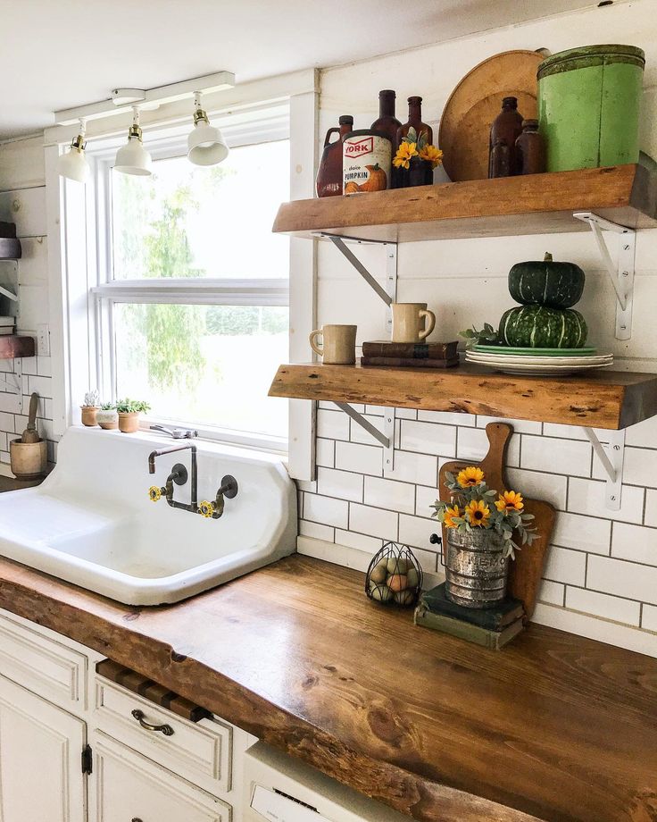 the kitchen counter is clean and ready to be used as a shelf above the sink