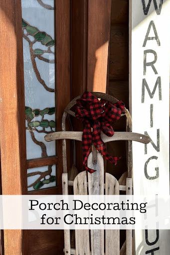 a wooden rocking chair sitting in front of a door with the words porch decor for christmas