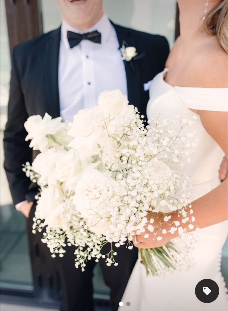 a bride and groom standing next to each other