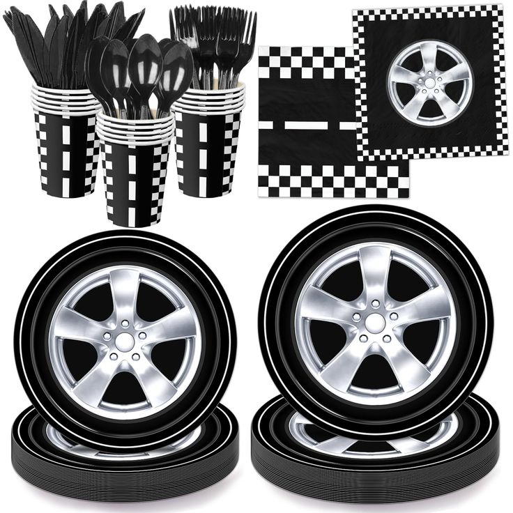 a set of four wheel rims, cups and forks with black and white checkers on them