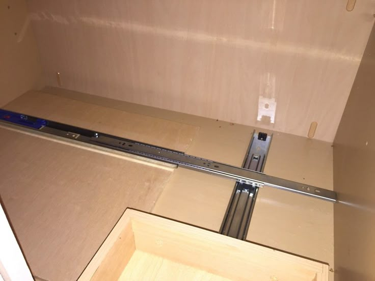 the bottom half of a refrigerator is being installed