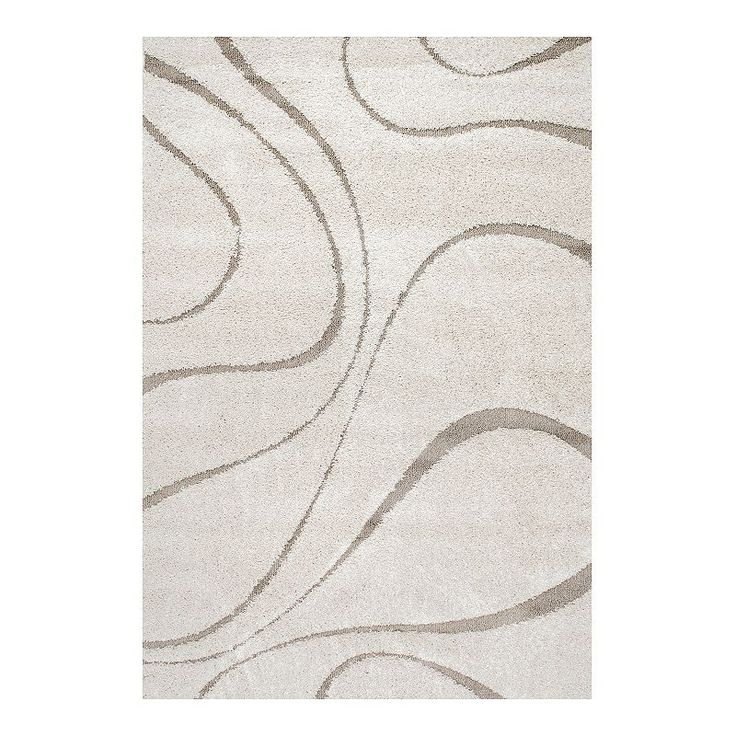 a white rug with wavy lines on it