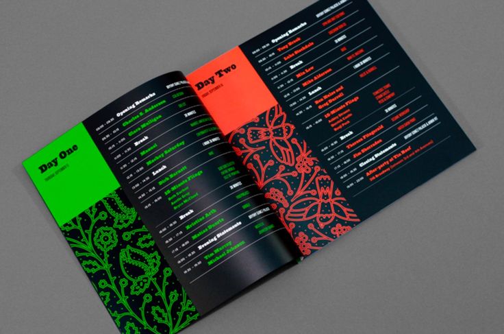 an open brochure with black and green designs on the front, orange and green details on the back