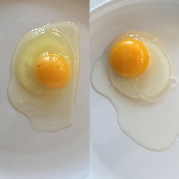 two fried eggs sitting on top of a white plate next to each other in the same bowl