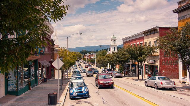 cars are parked on the street in front of shops and buildings with a sign that says salem, virginia