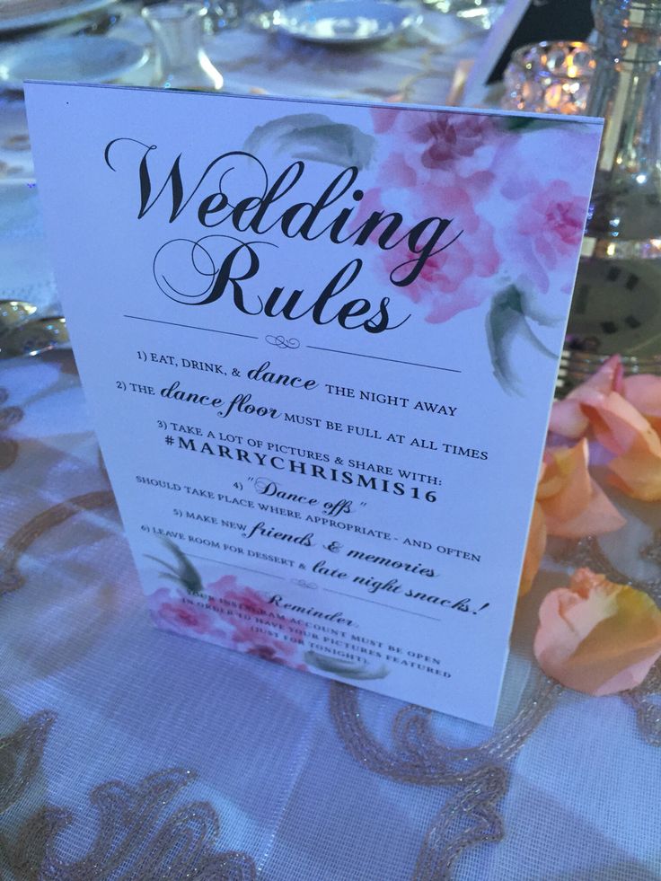 a table with flowers and menus on it