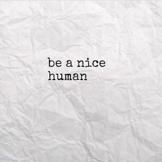 the words be a nice human written on white paper