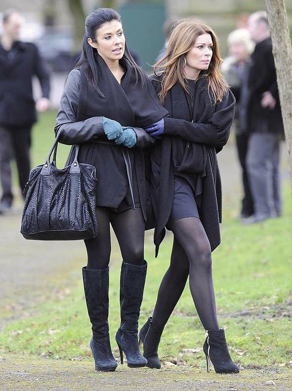 two women walking down the street together