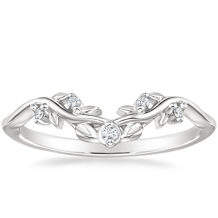 a white gold ring with leaves and diamonds