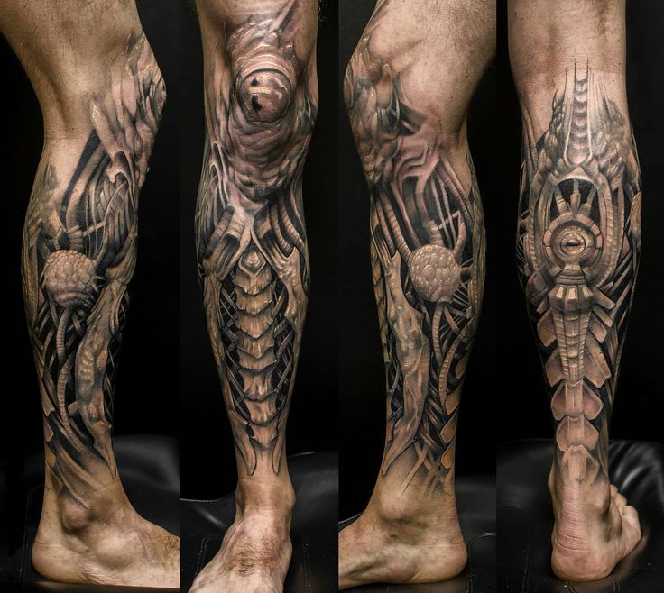 some tattoos on the legs and feet of a man with an intricate tattoo design in black and white