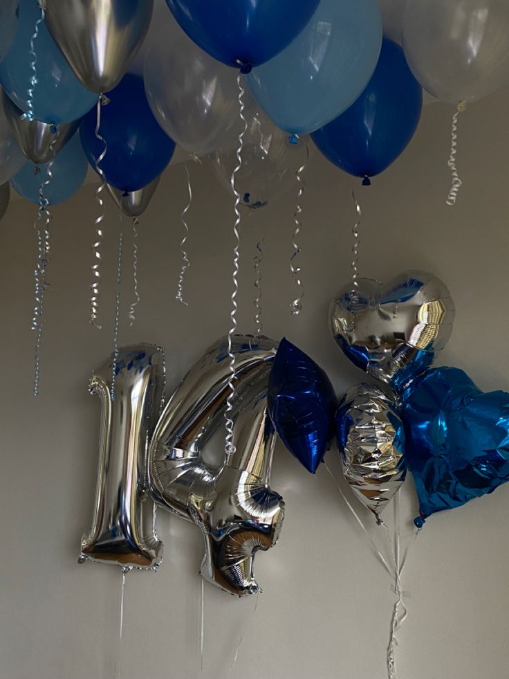 balloons and streamers are hanging from the ceiling