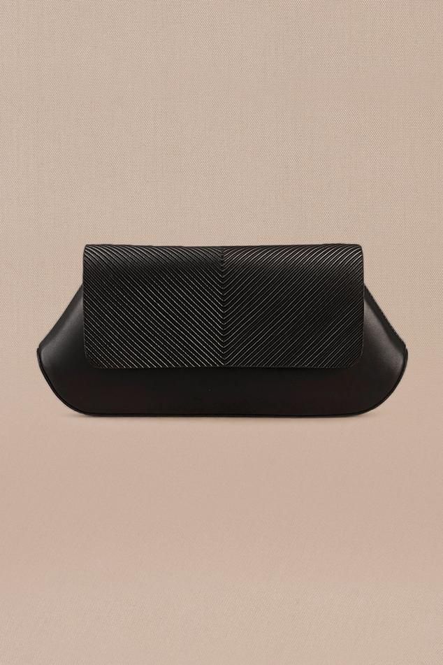 Black clutch in faux leather base with corded flap.
Composition: 100% PU/Faux Leather
Color: Black
Other Details: 
Dimensions (in inches): L x W x D: 10 x 1.8 x 4.5
 - Aza Fashions Rectangular Faux Leather Evening Clutch, Black Structured Shoulder Bag For Evening, Black Structured Evening Bag, Black Leather-lined Pouch Clutch, Modern Black Clutch In Soft Leather, Black Leather Pouch Clutch, Black Textured Leather Clutch For Everyday, Evening Structured Bags With Leather Lining, Structured Evening Bags With Leather Lining