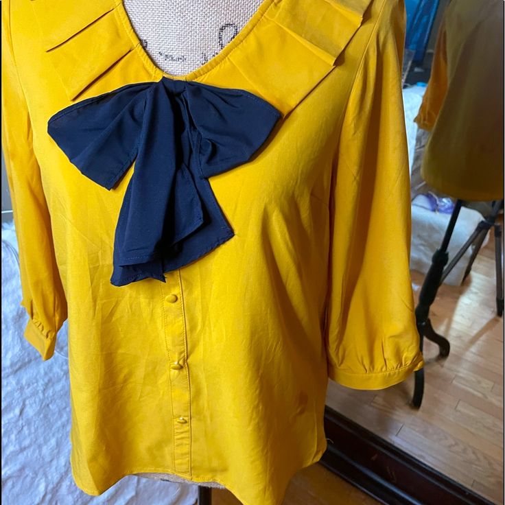 Cute Milk & Honey Bow Tie Blouse In Yellow And Blue. Bow Can Be Untied To Tie However Suits The Outfit. 3/4 Length Sleeve And Flowy Unstructured Fit. Never Worn Great Condition Yellow Summer Office Tops, Casual Yellow Office Blouse, Chic Yellow Blouse For Office, Chic Yellow Blouse For Work, Chic Yellow Blouse For The Office, Chic Yellow Office Blouse, Cute Milk, Bow Tie Blouse, Honey Yellow