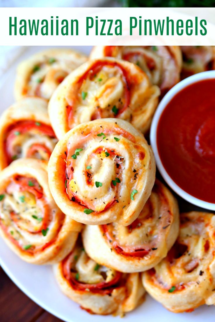 hawaiian pizza pinwheels on a white plate with ketchup and dipping sauce