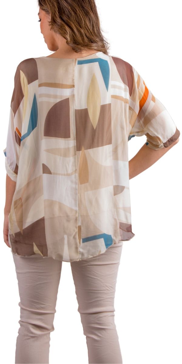 Our Classic Kaftan Style Blouse with Frayed Edge Under Layer Hem with a Graphic Shape Print. 100% Silk // Interior: 95% Viscose, 5% Elastic Fits Sizes XS- XL Made in Italy White Viscose Beach Tops, Summer Beige Silk Blouse, Beige Silk Blouse For Summer, Summer Beige Viscose Blouse, Beige Viscose Summer Blouse, Summer Viscose Tunic Top, Viscose V-neck Blouse For Beach, V-neck Viscose Blouse For Beach, Beach Rayon Blouse With Relaxed Fit