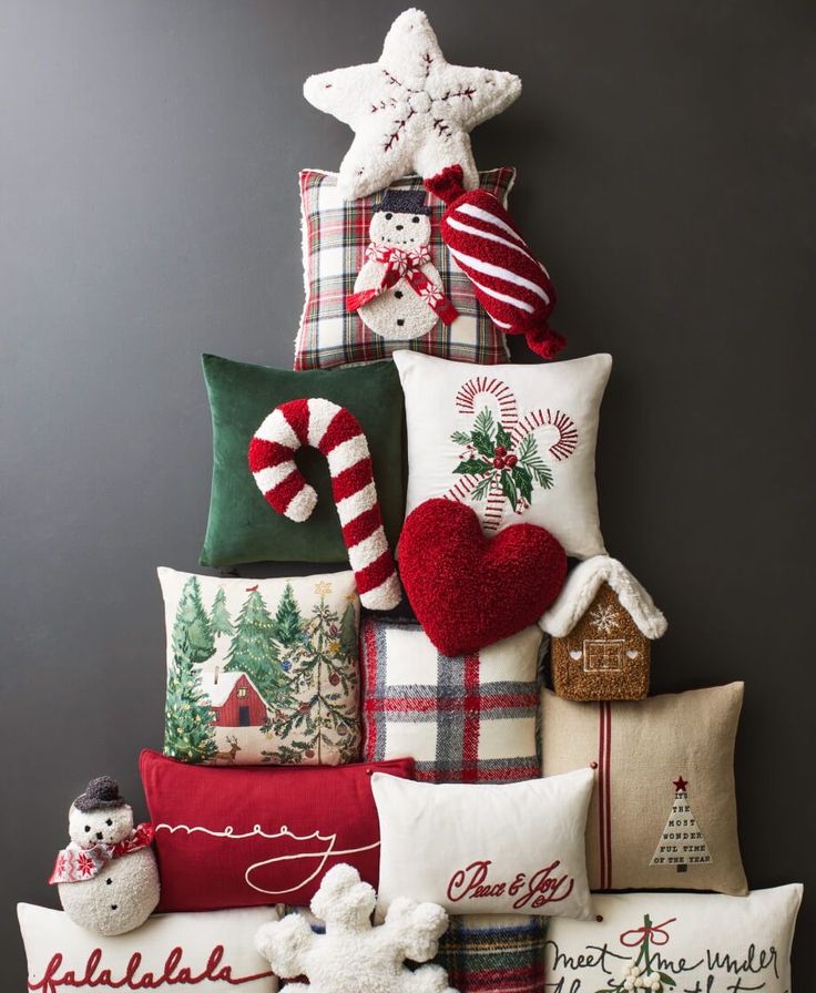 a christmas tree made out of pillows and other holiday decorations