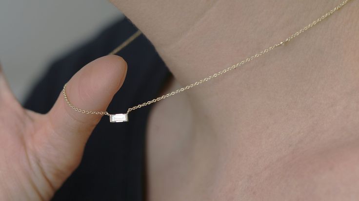 **Our diamonds are 100% REAL, natural earth mined** Pendant with 0.30 Carat of baguette-cut diamonds mounted in 14K Yellow Gold. non-traditional necklace with stunning horizontal baguette diamond that you will never take off! Setting -Total Carat Weight: 0.34 -14K White Gold -Size: Resizeable -Certificate Of Authenticity Included by www.gil-lab.com Main Diamond: -Round Brilliant -0.34 Carat -Color: F -Clarity: VS -Clarity Enhanced I would like to inform you that there may be a deviation of about Minimalist Baguette Cut Diamond Necklace For Anniversary, Gift 14k Gold Diamond Necklace With Baguette Diamonds, Minimalist Baguette Diamond Necklace For Anniversary, Minimalist Baguette Diamond Cut Jewelry, Minimalist Baguette Diamond Jewelry, Minimalist Baguette Single Cut Diamond Jewelry, Minimalist Baguette Diamond Jewelry As Gift, White Baguette Jewelry For Gift, Minimalist Diamond Necklace With Baguette Cut