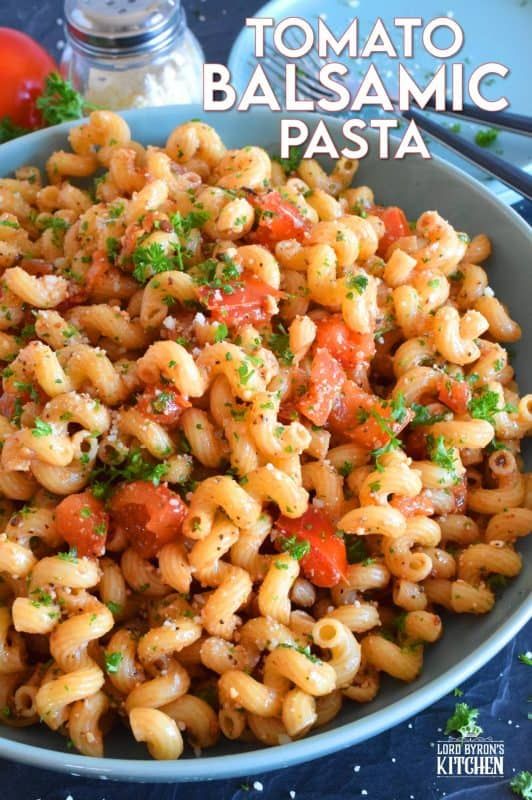 pasta with tomatoes and parsley in a bowl