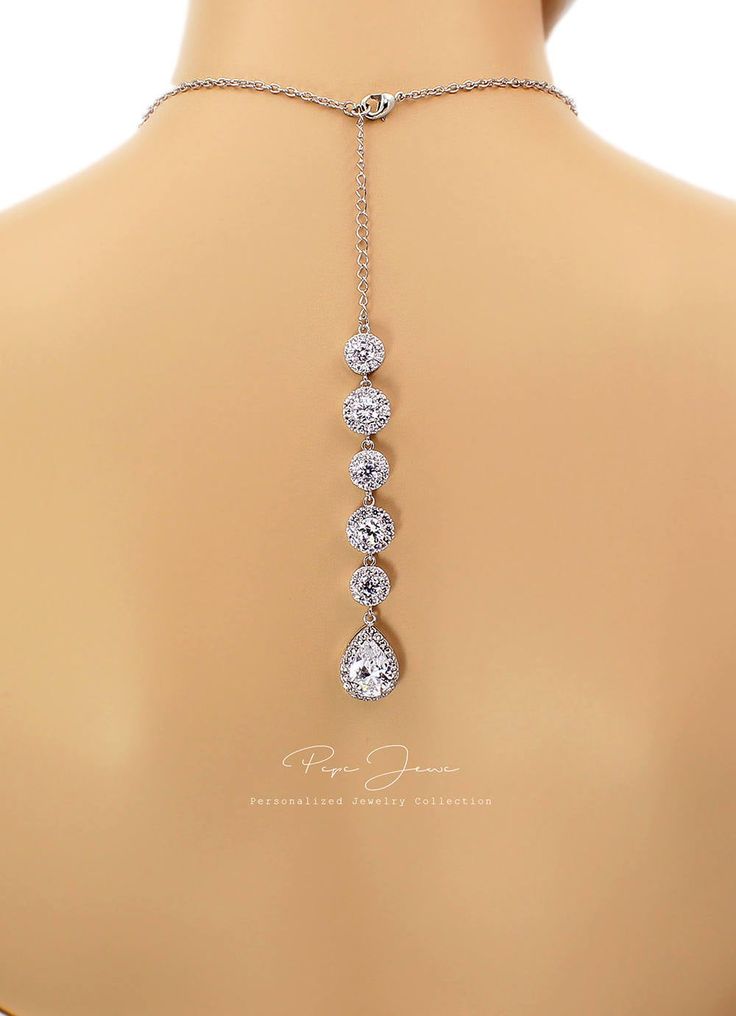 "Finish: Silver Platinum plated components Material: Top quality rhinestones, AAA Zirconia, lobster clasp. Length of Necklace: 17.5 inches and 5 3/4\" Zirconia backdrop. Length of Earrings: 1 1/4 inches from the top of the post. Quantity: Necklace + Earrings Weight: 10g + 35g Items Condition: 100% Brand New You can find this collection here: https://www.etsy.com/shop/PepeJewe?ref=listing-shop2-all-items-count&search_query=Perl You can find Zirconia jewelry here : https://www.etsy.com/shop/Pe Hand Set Silver Drop Jewelry, Cubic Zirconia Jewelry With Handset Stones As Gift, Wedding Jewelry With Adjustable Chain And Pendant, Teardrop Cubic Zirconia Jewelry With Adjustable Chain, Hand Set Sterling Silver Drop Jewelry, Sterling Silver Hand Set Drop Jewelry, Nickel Free Crystal Jewelry For Anniversary, Gift Jewelry With Handset Crystal Stones, Silver Drop Jewelry With Jewels