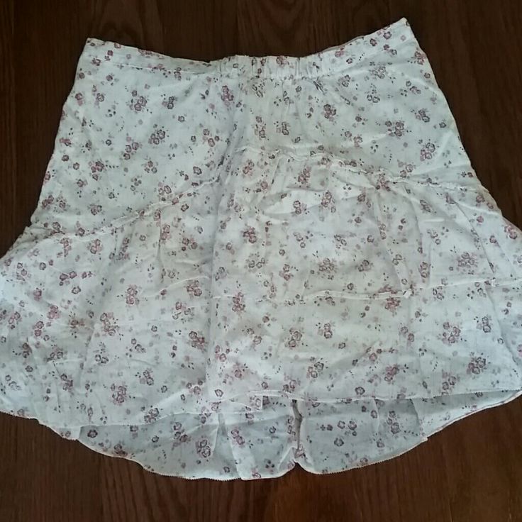 New Without Tags. Never Worn. Adorable Layered Ruffle Skirt. Hits About Mid Thigh. Somewhat Flowy. An Off White Color With Rose/Mauve Flowers.Has A Liner Under Skirt. Spring Pink Mini Skirt With Ruffle Hem, Pink Skirted Skort With Ruffle Hem, Pink Ruffle Hem Skort For Summer, Pink Flowy Skort For Spring, Pink Ruffled Skirt For Day Out, Spring Pink Flowy Skort, Casual Pink Skirt With Ruffle Hem, Pink Ruffle Hem Skort, Cute Pink Skirt With Ruffle Hem