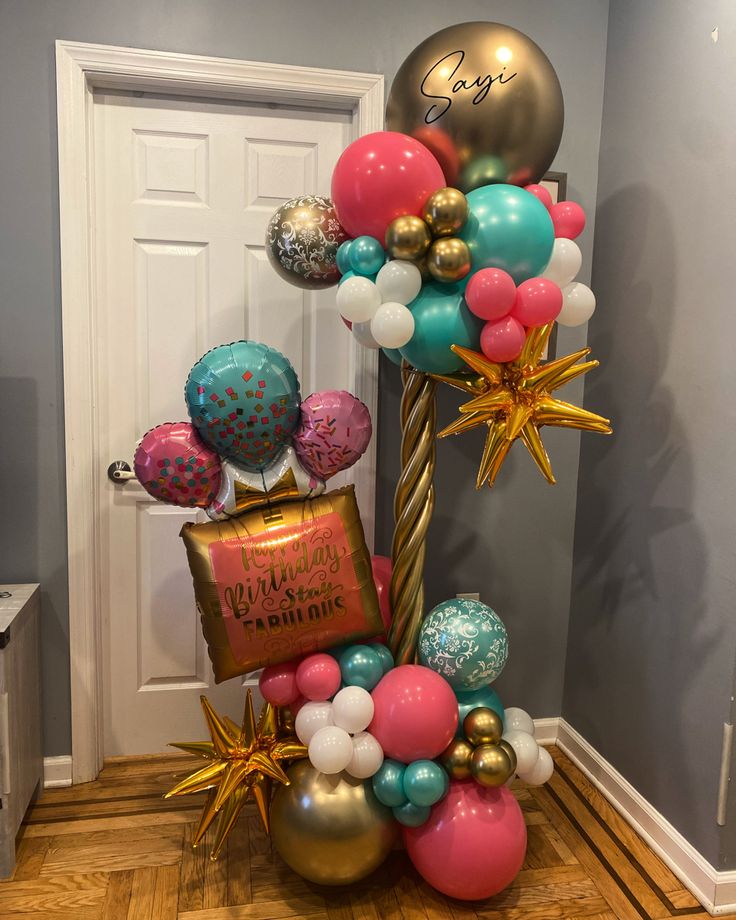 balloons and streamers are on the floor in front of a door