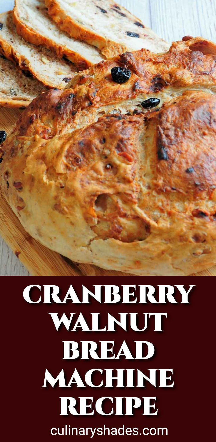 a loaf of cranberry walnut bread on a cutting board with text overlay that reads, cranberry walnut bread machine recipe