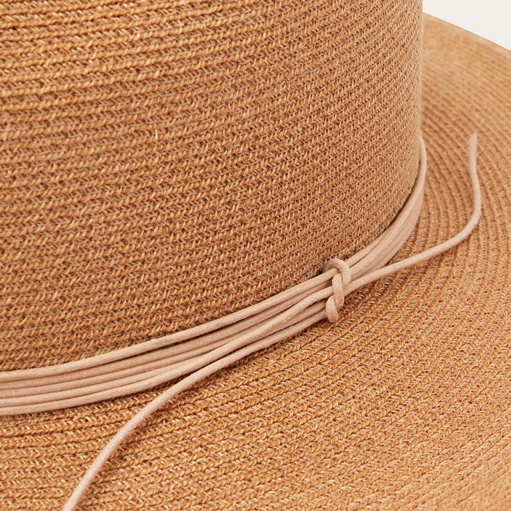 The Magic Eye Straw Hat is crafted from high-quality 100% shantung straw. It has a 3” brim and a 4” x 5 1/2” sloped Gus crown—a classic statement making western style. It’s complemented by a silk cord hat band and Stetson hat. A genuine leather sweatband for a time-tested fit and all-day comfort. Handmade in the U.S.A. with the finest construction and materials, our straw hats are made to stand the test of time. 4” x 5 1/2” Gus Crown 3” Brim Silk Cord Hat Band Stetson Hat Pin Genuine Leather Swe Elegant Flat Brim Sun Hat For Country Events, Elegant Fedora Sun Hat For Country Events, Elegant Straw Hat For Country Events, Elegant Toquilla Straw Hat For Country Events, Western Straw Boater Hat With Short Brim, Western Style Straw Boater Hat With Short Brim, Straw Boater Hat With Wide Brim For Rodeo, Elegant Natural Straw Hat For Rodeo, Wide Brim Panama Hat For Country Events