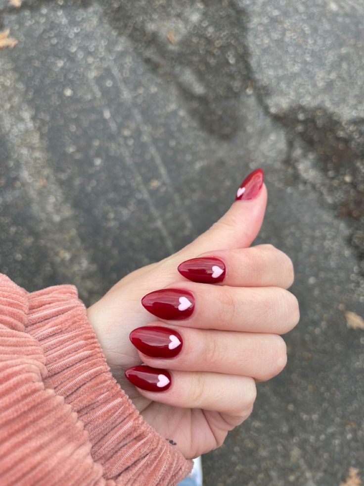 Red With Pink Hearts Nails, Burgundy Nails Valentines, Dark Red Nails With White Heart, Dark Red Nails Valentines, Red Nail With Heart, Red Valentine Day Nails, Pink White Red Nails, Heart Ring Finger Nails, Red Nails With Hearts Valentines