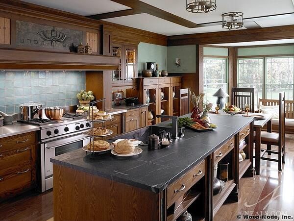 a kitchen filled with lots of counter top space and wooden cabinets next to an oven