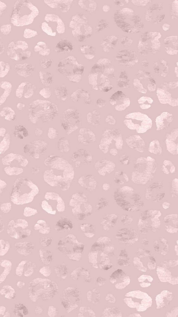 an animal print background with pink and white spots on the bottom half of the image