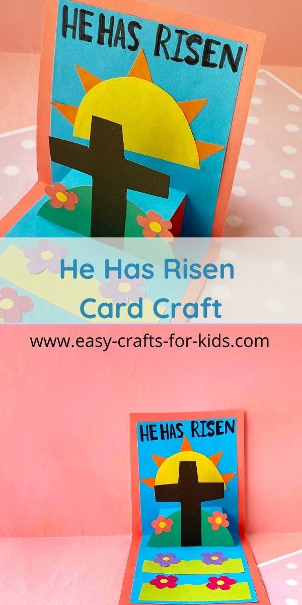 a card that has been made to look like a cross and the words he has risen on it