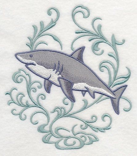 a white towel with a gray shark on it's side and blue swirls around the edges