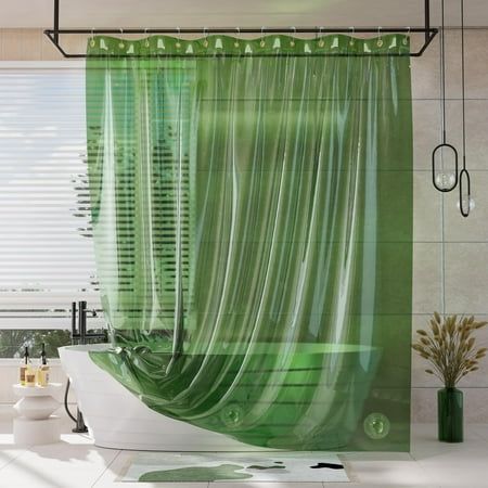 a bath room with a tub and a shower curtain