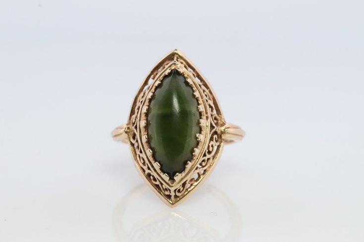 Wonderful Dark Green Jade Cabochon ring. Jade is dark green color. Bezel set.  3.4grams total weight 15mm by 7mm marquise cabochon Hallmarked and tested 14k sz7 Stock111 Elegant Green Cabochon Emerald Ring, Elegant Green Emerald Cabochon Ring, Heirloom Green Oval Cabochon Jewelry, Heirloom Green Oval Cabochon Rings, Heirloom Jade Jewelry In Green, Heirloom Green Jade Jewelry, Heirloom Green Cabochon Jewelry, Green Gemstone Heirloom Jewelry, Green Oval Heirloom Jewelry