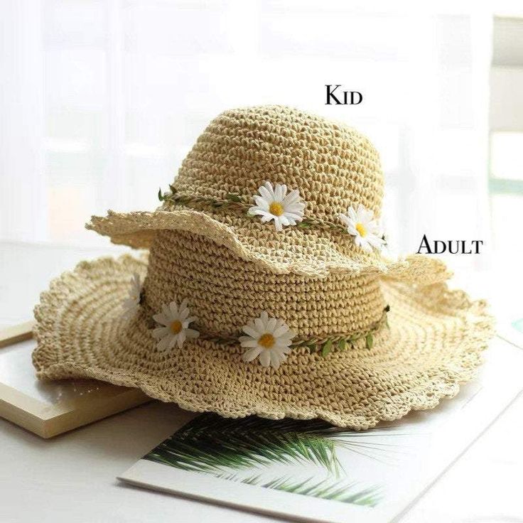 Stay stylish and protected with our matching family straw hats. Made from lightweight, breathable natural straw, these hats feature a wide, scalloped brim for excellent sun protection and are adorned with charming artificial daisies. Available in both kid and adult sizes, they are perfect for creating adorable matching outfits for beach outings, garden parties, and picnics. Enjoy comfort and whimsy with these durable, fashionable hats. Material: 100% strawSize:Adult Size: Head size 54-58cmKid Si Adjustable Summer Hats For Picnic, Summer Sun Hat For Picnic, Casual Paper Straw Sun Hat For Spring, Wide Brim Sun Hat For Garden Party In Summer, Spring Bucket Hat Made Of Straw, Summer Garden Party Sun Hat With Wide Brim, Summer Garden Party Wide Brim Sun Hat, Summer Straw Sun Hat For Picnic, Summer Straw Hat For Picnic